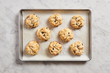 Half sheet pan with baked scones on it