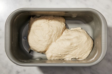 Bread machine bucket with bread dough in it
