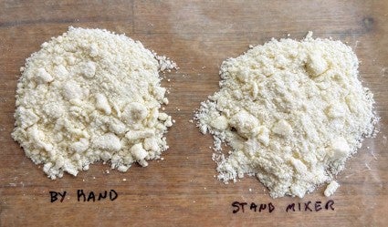 Pie crust before adding the liquid showing the equal crumbliness of handmade vs. crust made in a stand mixer.