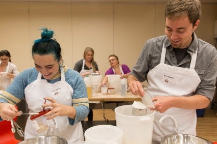 Two King Arthur employee-owners bake for donating