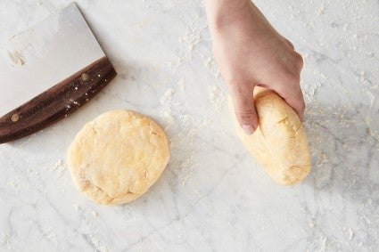 Rolling pie crust into disks with smooth edges