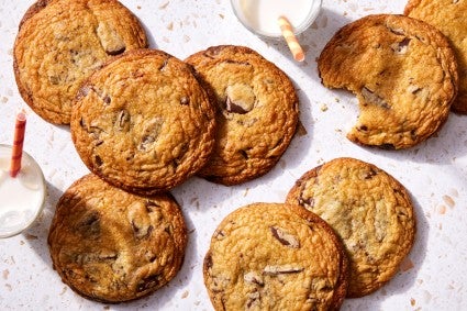 Chocolate chip cookies next to bag of milk