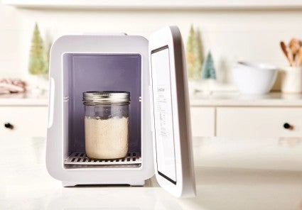 A jar of active starter in the Sourdough Home