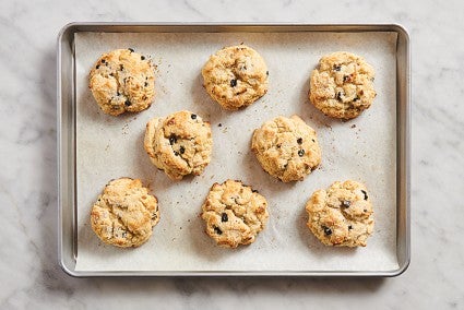 Round scones on parchment-lined baking sheet