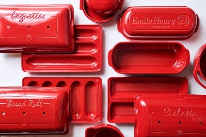 Multiple red covered bakers in various shapes and sizes