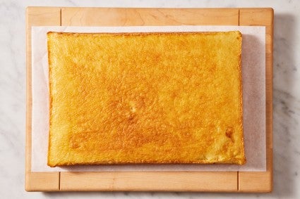 A half-sheet pan sized layer of hot milk cake