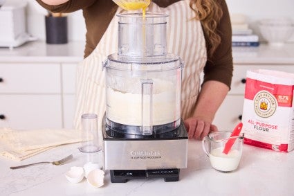 Adding liquids to food processor to make dough 