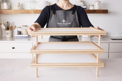 pasta drying tray being stacked