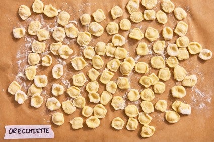 The form of the Oregiette pasta on a parchment line baking sheet