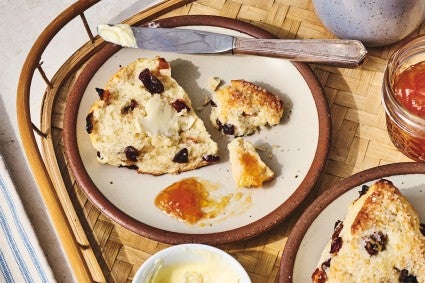 A Cream Tea Scones broken up on a plate