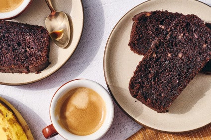 Double Chocolate Banana Bread on a plate with some coffee