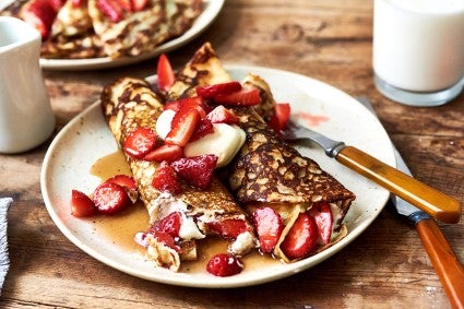 Pittsburgh's Finest Diner Pancakes on a plate with maple syrup and strawberries