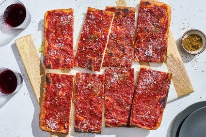Rhode Island Pizza Strip sliced and arranged on a cutting board.