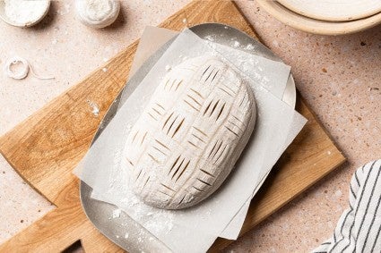 Sourdough loaf with a basket weave design scored into it