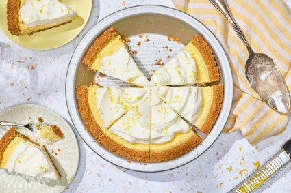 Lemon Cream Pie sliced in a pie pan, seen from above