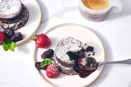 Flourless Chocolate Lava Cake seen from above with a scoop of gooey cake on a spoon