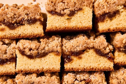 Slices of Apple Crumb Cake stacked and arranged neatly