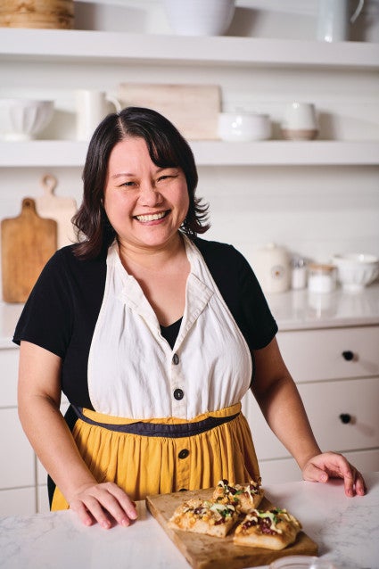 A headshot of Joy Huang with Taiwanese Sourdough Focaccia