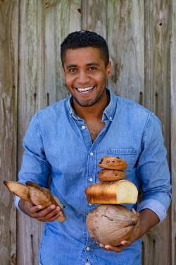 Bryan Ford holding various breads
