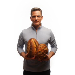 Martin Philip with two loaves of bread