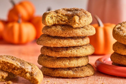 Pumpkin Snickerdoodle Cookies stacked on a counter