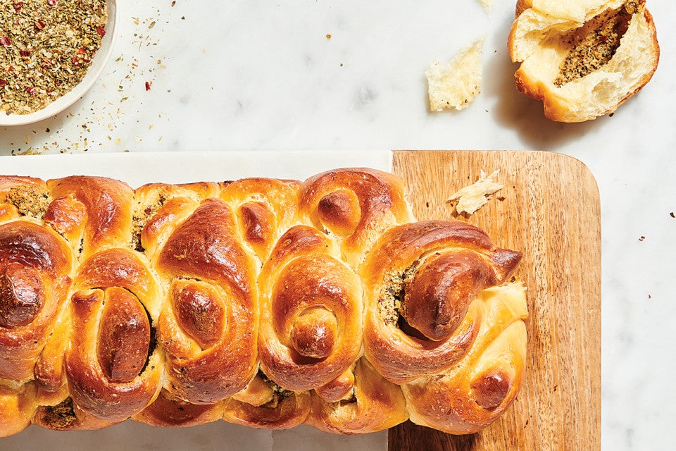 Handkerchief Butterflake Herb Rolls on cutting board on counter