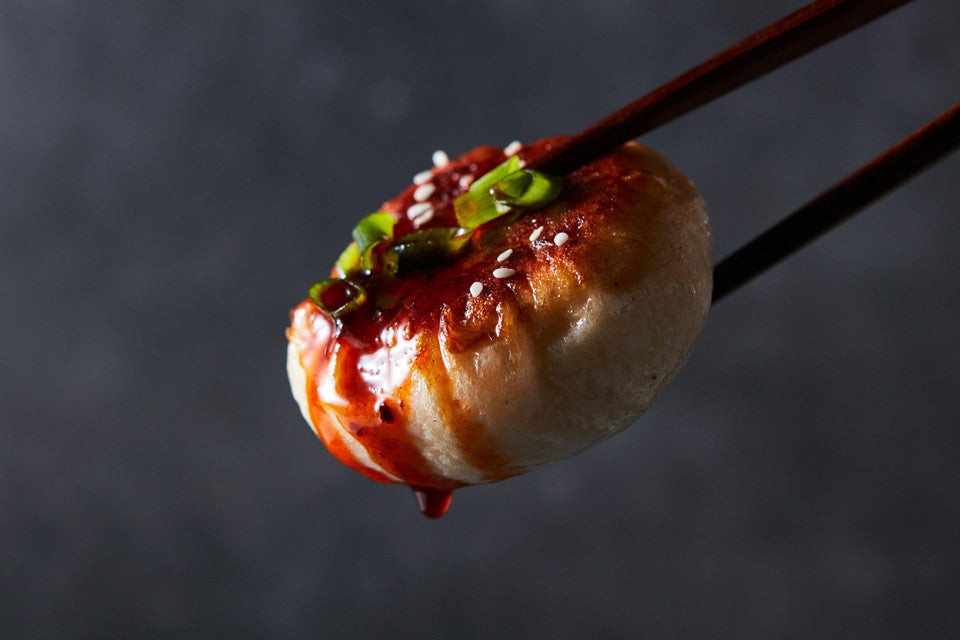 Mushroom and Cabbage Pan-Fried Bun in chopsticks