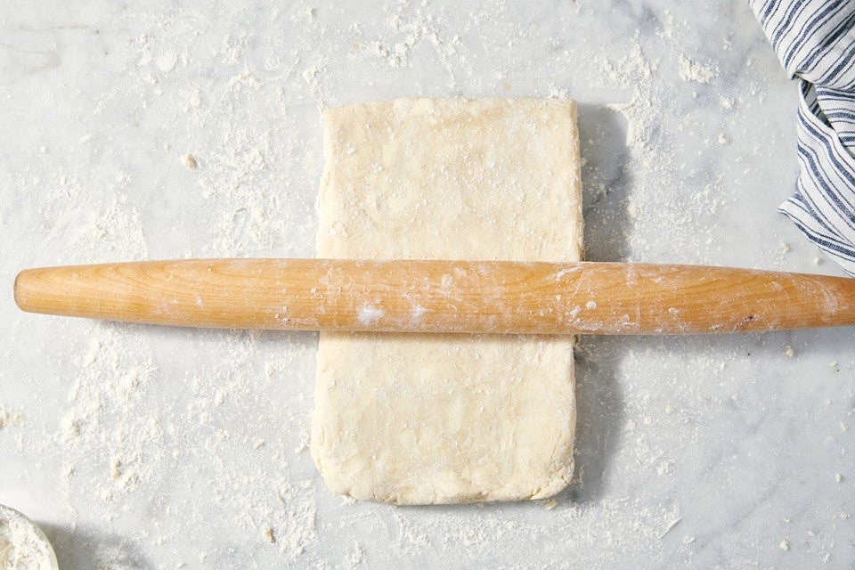 All-Purpose Flaky Pastry Dough underneath a rolling pin