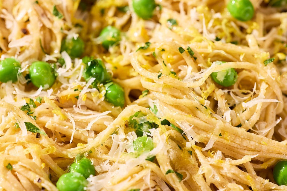 Whole Wheat Pasta with shredded cheese and peas