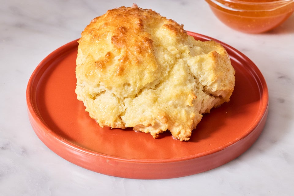 A single Cathead Biscuit on a plate
