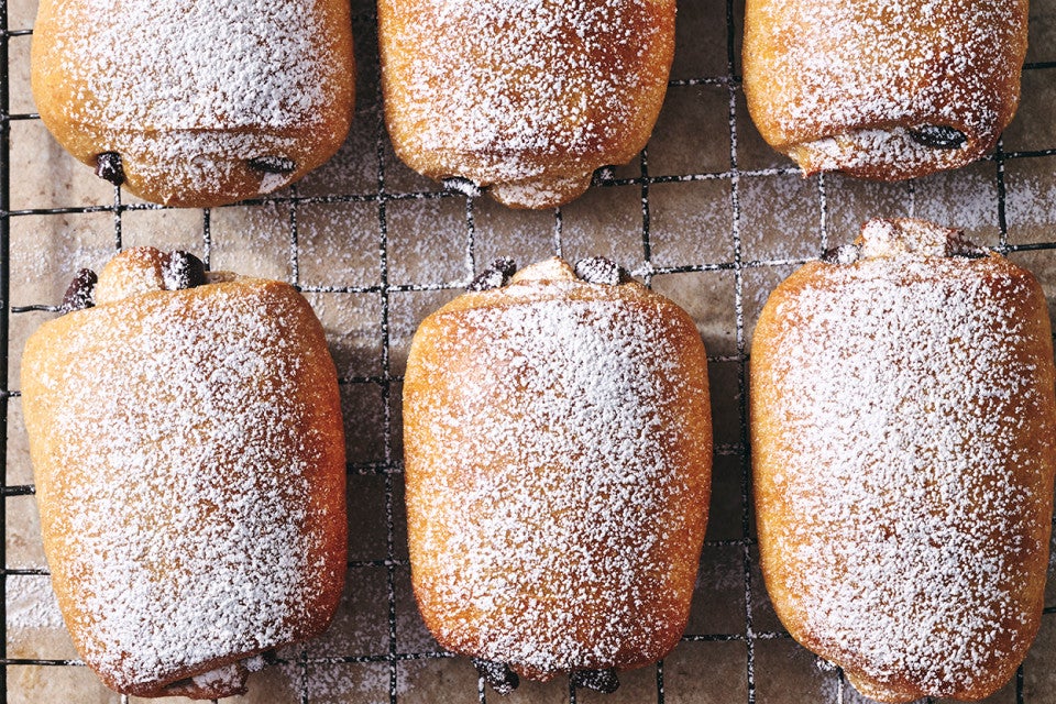 Dark Chocolate-Filled Soft Rolls on a cooling rack