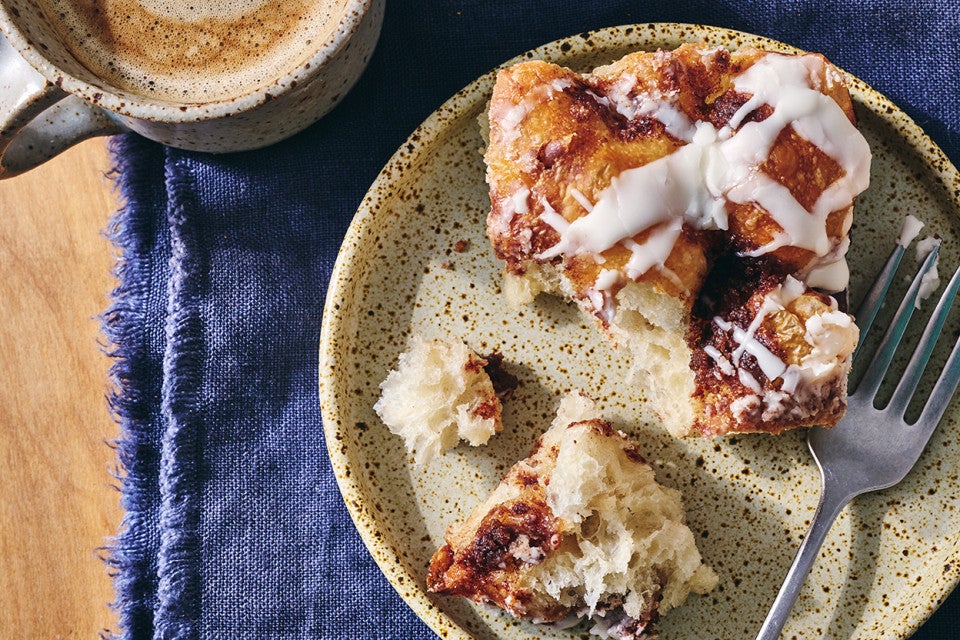 Cinnamon Roll Focaccia broken up on a plate
