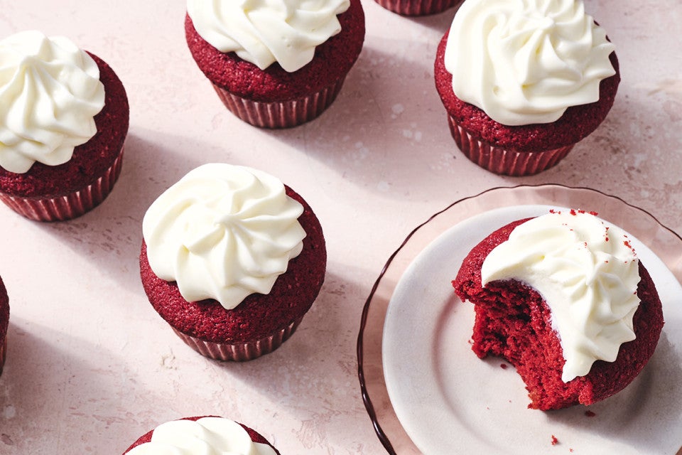 Red Velvet Cupcakes, one with a bite taken out