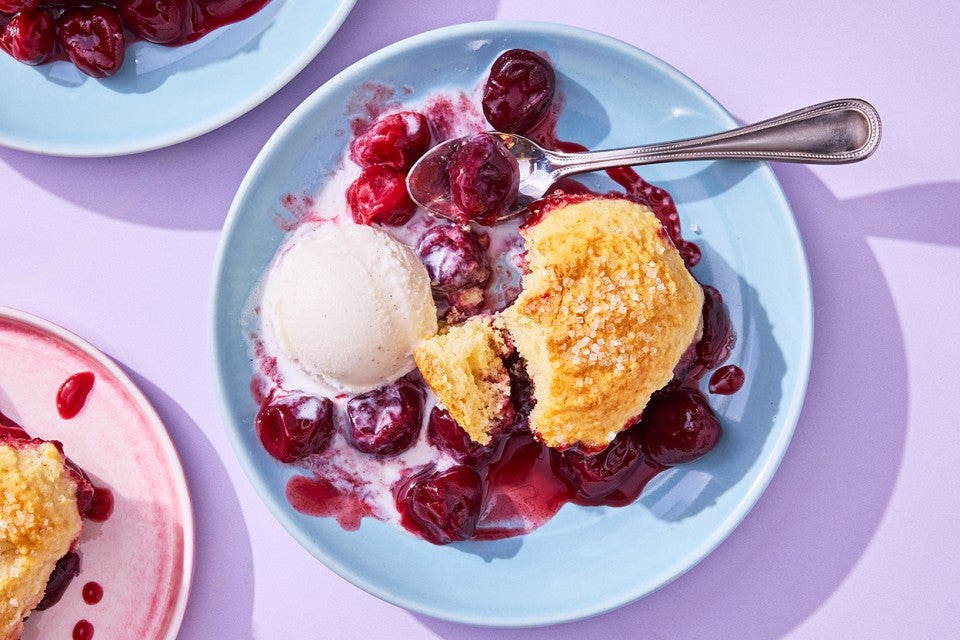 Buttermilk Biscuit Cherry Cobbler on a plate with ice cream