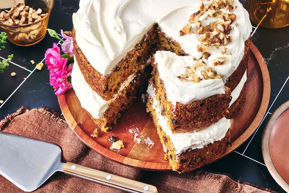 Close up of Gluten-Free Carrot Cake with Cream Cheese Frosting with a slice cut out