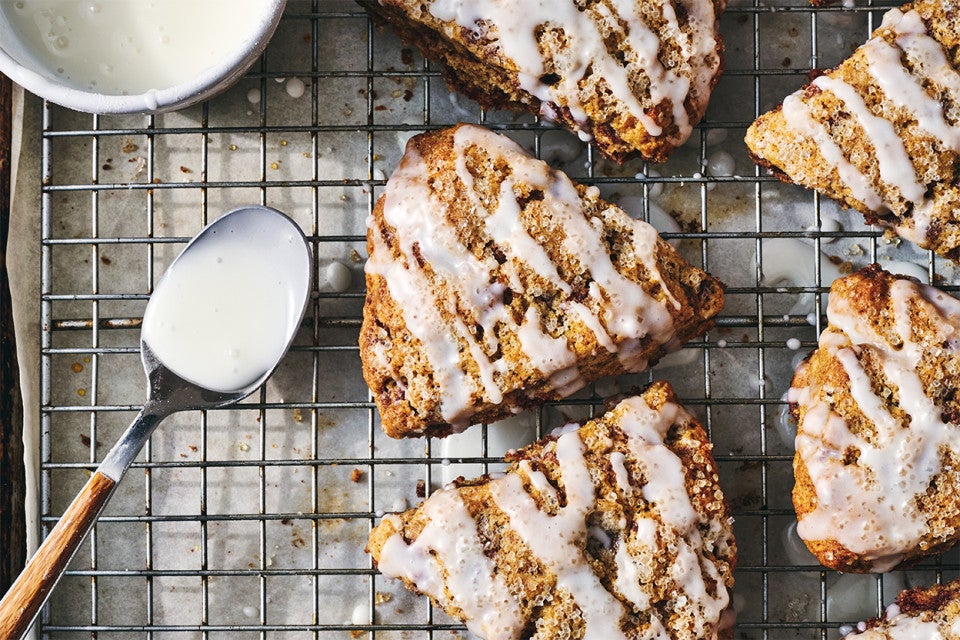 Cinnamon Whole Wheat Scones on a cooling rack after being glazed