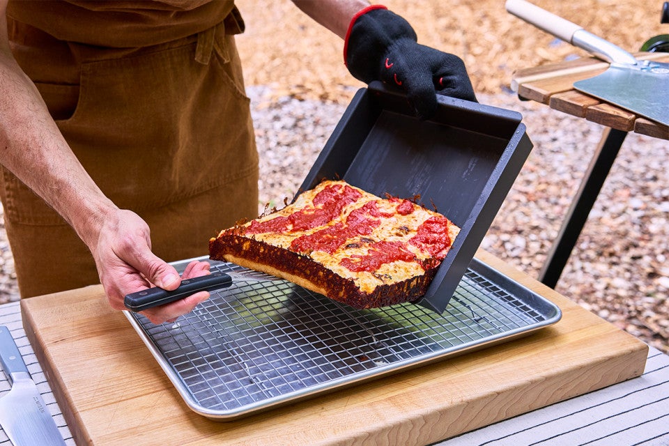 Pizza Oven Detroit Pizza coming out of the pan