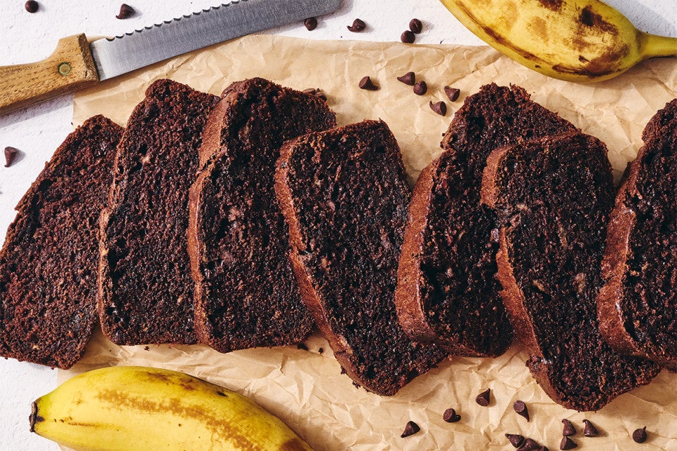 Double Chocolate Banana Bread sliced on a cutting board