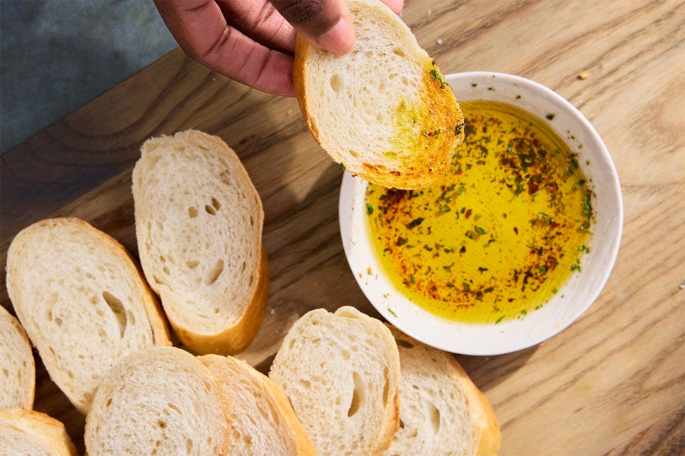 Food Processor French-Style Bread being dipped in oil