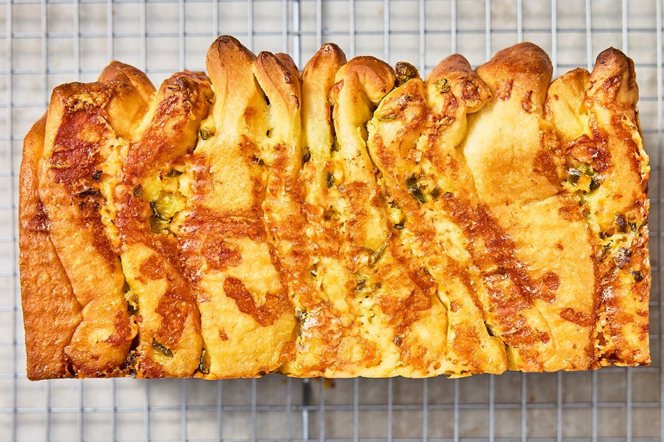 A loaf of Jalapeño-Cheddar Pull-Apart Bread on a cooling rack