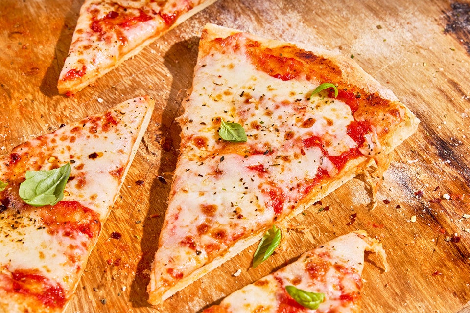 Slices of No-Knead Pizza Crust on a cutting board
