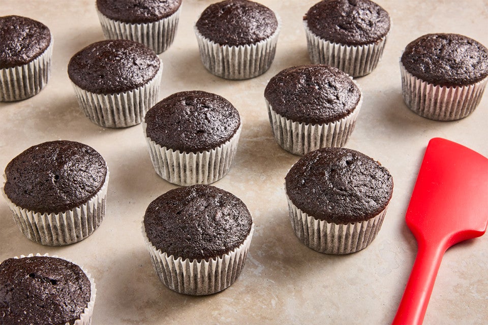 Bake Sale Fudge Cupcakes on a counter before being frosted