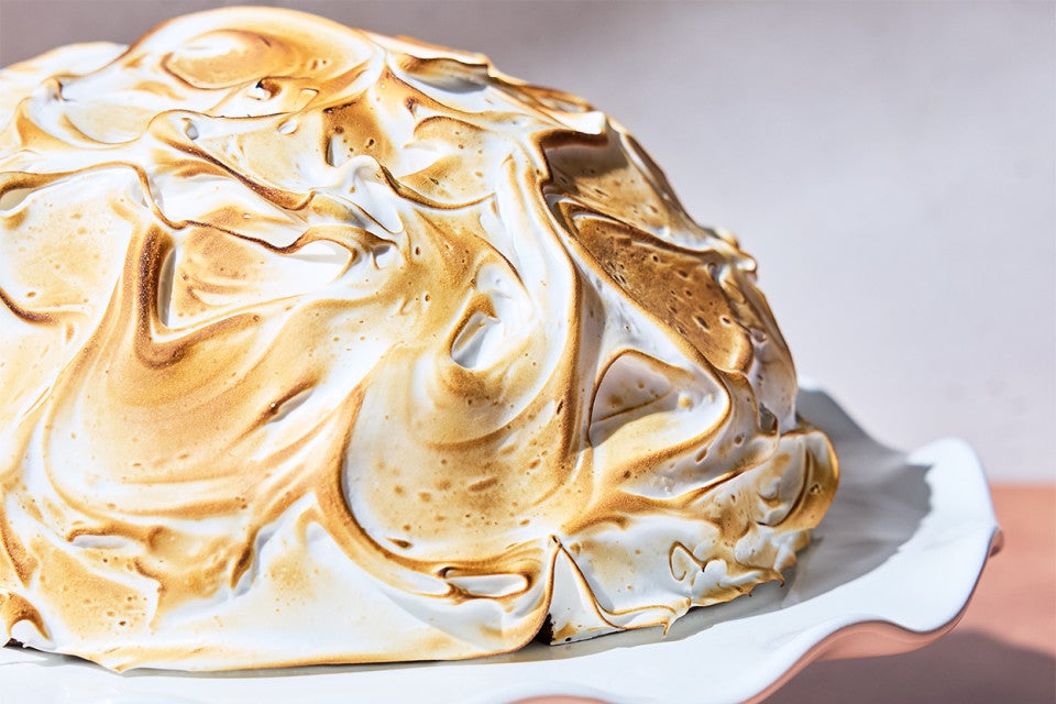 Baked Alaska on a serving tray un-cut