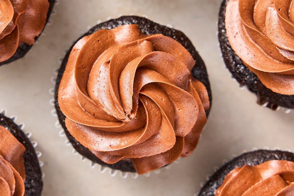 Chocolate Buttercream frosting piped onto chocolate cupcakes