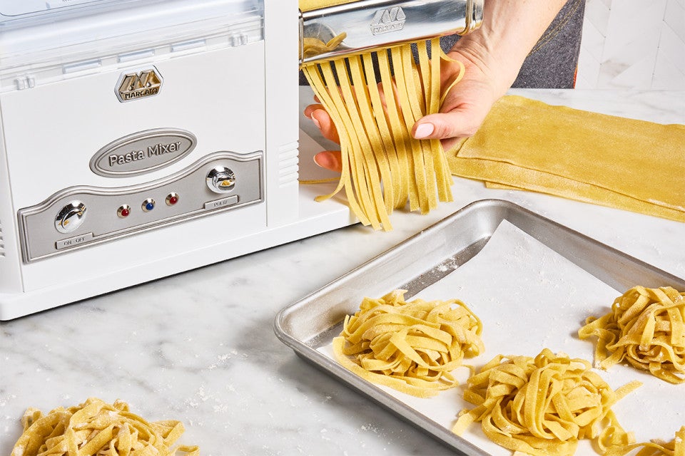 Homemade Pasta being made with a pasta machine