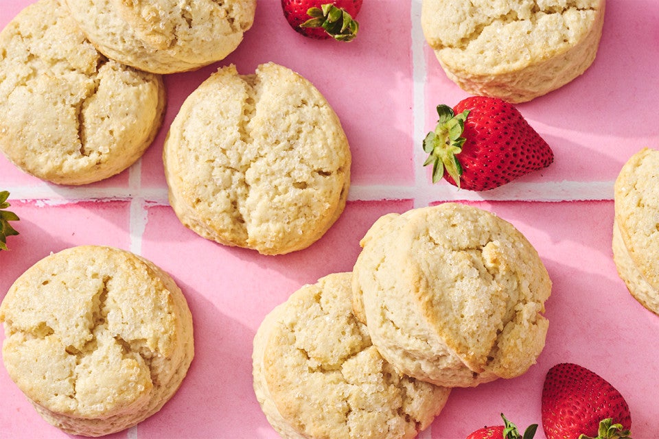 Self-Rising Cream Biscuits on a counter with strawberries