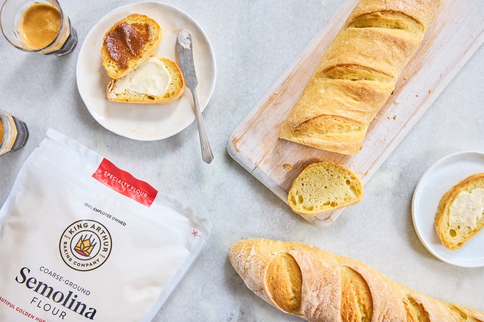 Semolina Baguettes; one has been sliced