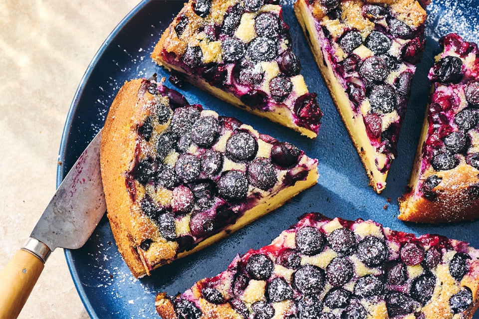 Several slices of Blueberry Breakfast Cake on a plate