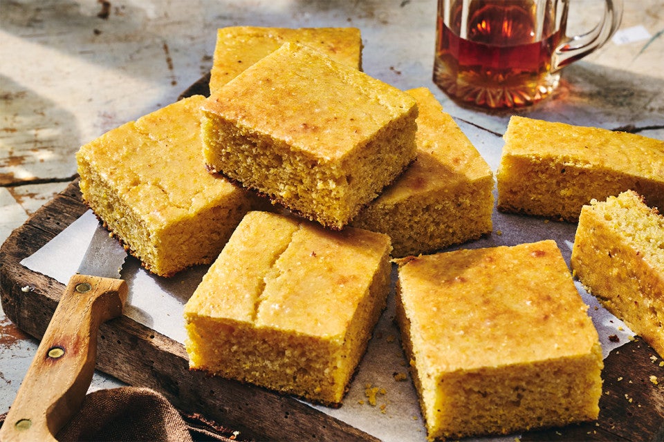 Pieces of Maple Cornbread on a cutting board
