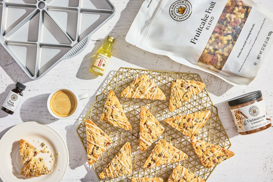 Fruitcake scones photographed from overhead and an arrangement of ingredients from King Arthur Baking.